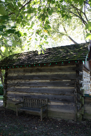 Log Cabin Out Building with Bench