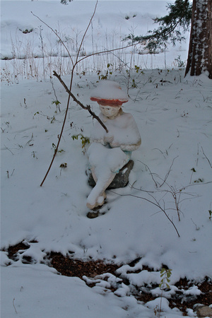 Fishing Boy Statue in Snow